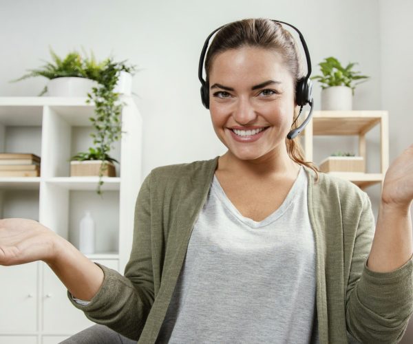 woman-with-headset-using-laptop woman-with-headset-using-laptop
